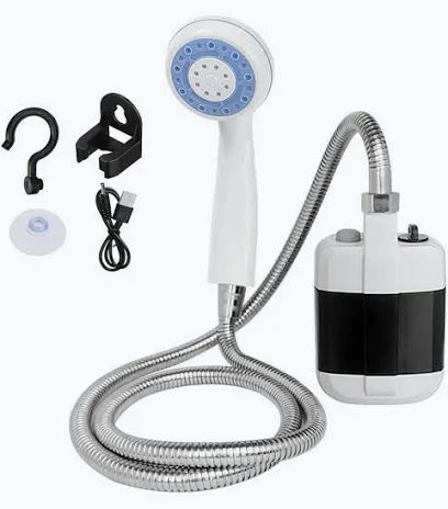 White and black compact portable shower pump with blue-faced handheld head, silver hose, hook, holder, suction cup and USB cable
